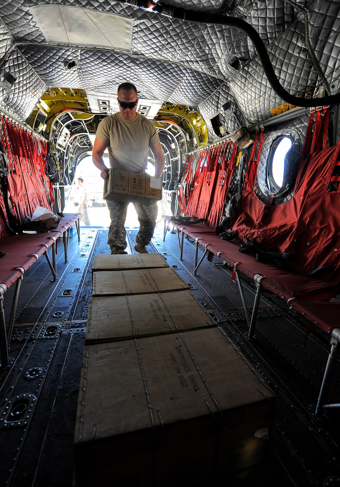U.S. Army Sgt. Patera, Task Force Tatanka CH-47D Chinook pneudraulics, loads 7.62 NATO ammunition in a CH-47 during Angel Thunder 2015 at Davis-Monthan Air Force Base, Ariz., June 2, 2015. The Task Force Tatanka is made up of three companies from the Montana Army National Guard’s 1-189th General Support Aviation Battalion. (U.S. Air Force photo by Staff Sgt. Angela Ruiz/Released) 