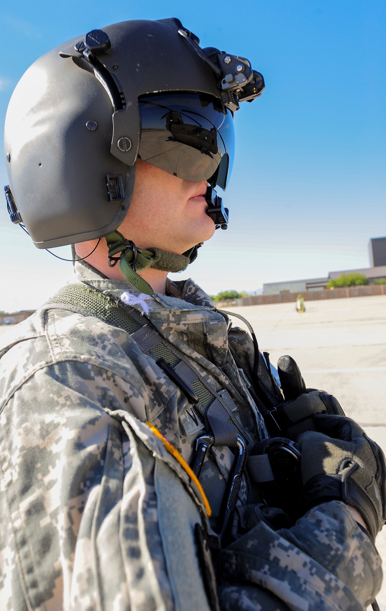 U.S. Army Staff Sgt. Westly Vincent, Task Force Tatanka, CH-47D Chinook flight engineer, stands by for communication from the a pilot during start up procedures prior to take off during Angel Thunder 2015 at Davis-Monthan Air Force Base, Ariz., June 2, 2015. The objective of the exercise is to train personnel recovery forces to prepare, plan, execute and adapt for a rescue misson. Task Force Tatanka is made up of three companies from the Montana Army National Guard’s 1-189th General Support Aviation Battalion.(U.S. Air Force photo by Staff Sgt. Angela Ruiz/Released)
