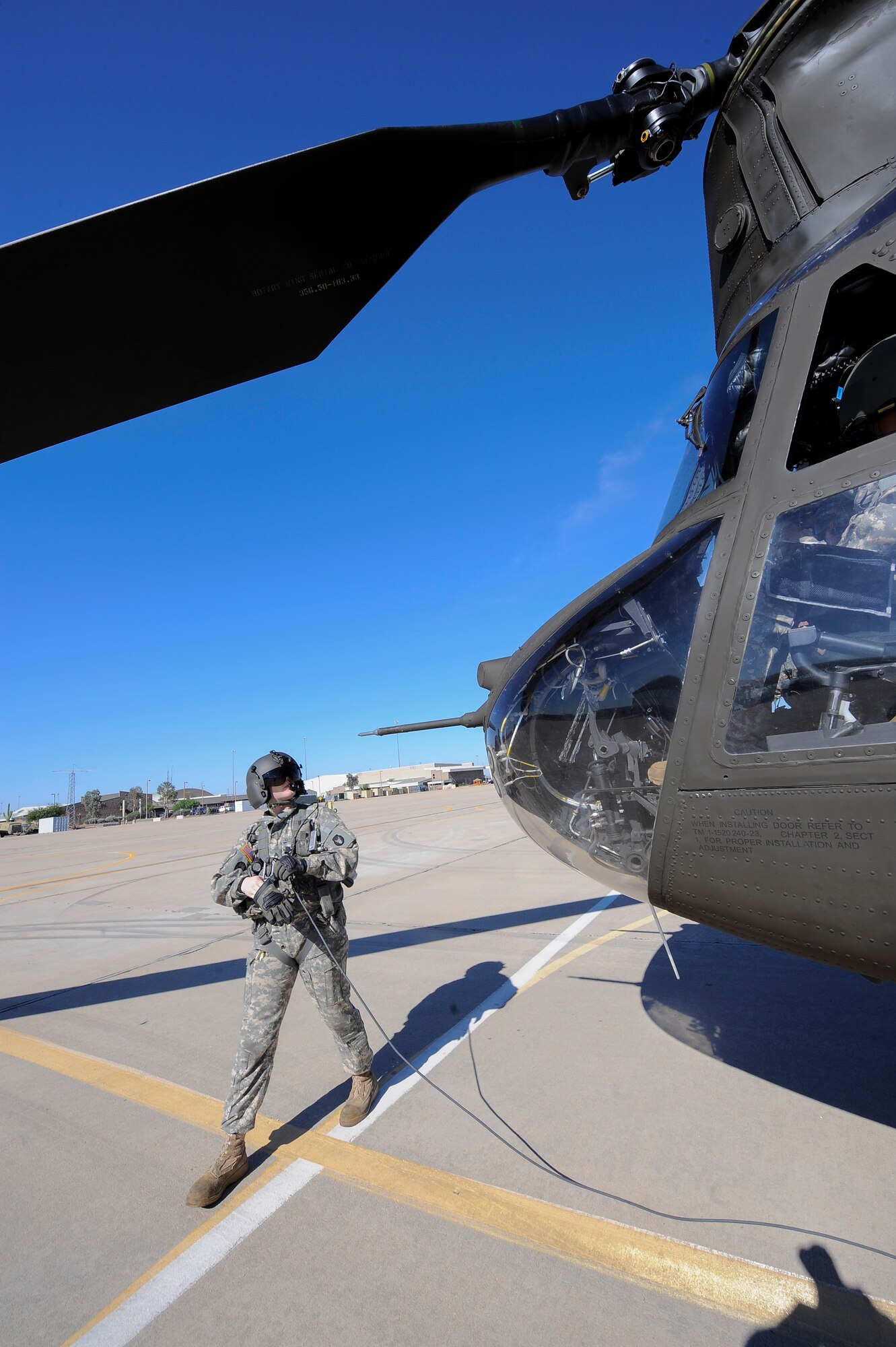 U.S. Army Staff Sgt. Westly Vincent, Task Force Tatanka, CH-47D Chinook flight engineer, conducts start up procedures prior take off during Angel Thunder 2015 at Davis-Monthan Air Force Base, Ariz., June 2, 2015. Angel Thunder is hosted by the 355th fighter Wing at Davis-Monthan AFB but many flying operations will extend throughout Arizonam New Mexico and California. Task Force Tatanka is made up of three companies from the Montana Army National Guard’s 1-189th General Support Aviation Battalion.(U.S. Air Force photo by Staff Sgt. Angela Ruiz/Released)