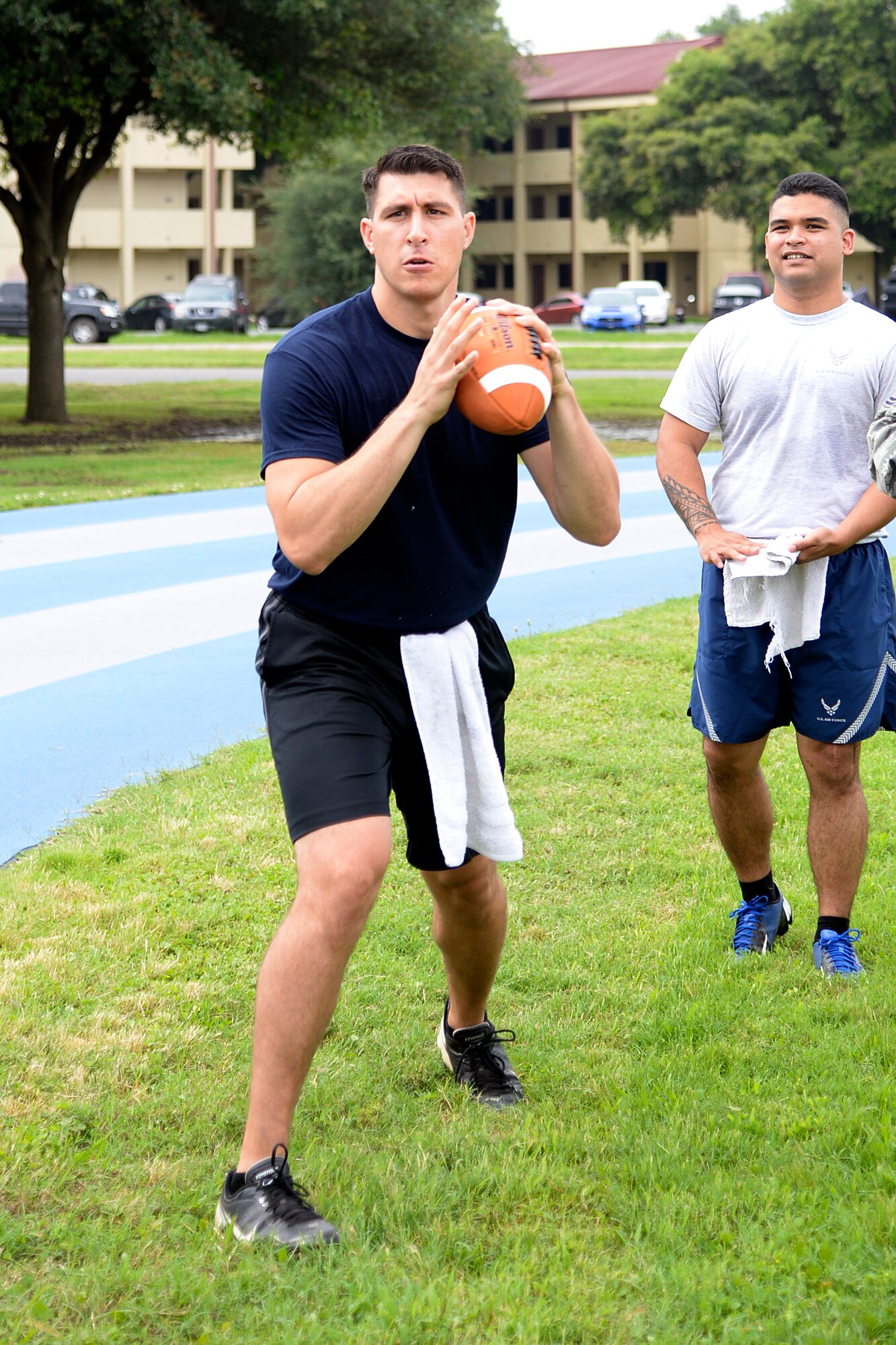 An Airman with the 26th Operational Weather Squadron prepares to throw a football during the Quarterback Skills competition as part of Sports Day at Barksdale Air Force Base, Louisiana, May 29, 2015. The 26th OWS took overall 3rd place in the event giving their unit an additional three points added to their 10 participation points. Sports Day consisted of various team events including dodgeball, tug-of-war, soccer, volleyball, basketball and a homerun derby. (U.S. Air Force photo/Tech. Sgt. Marie Brown)