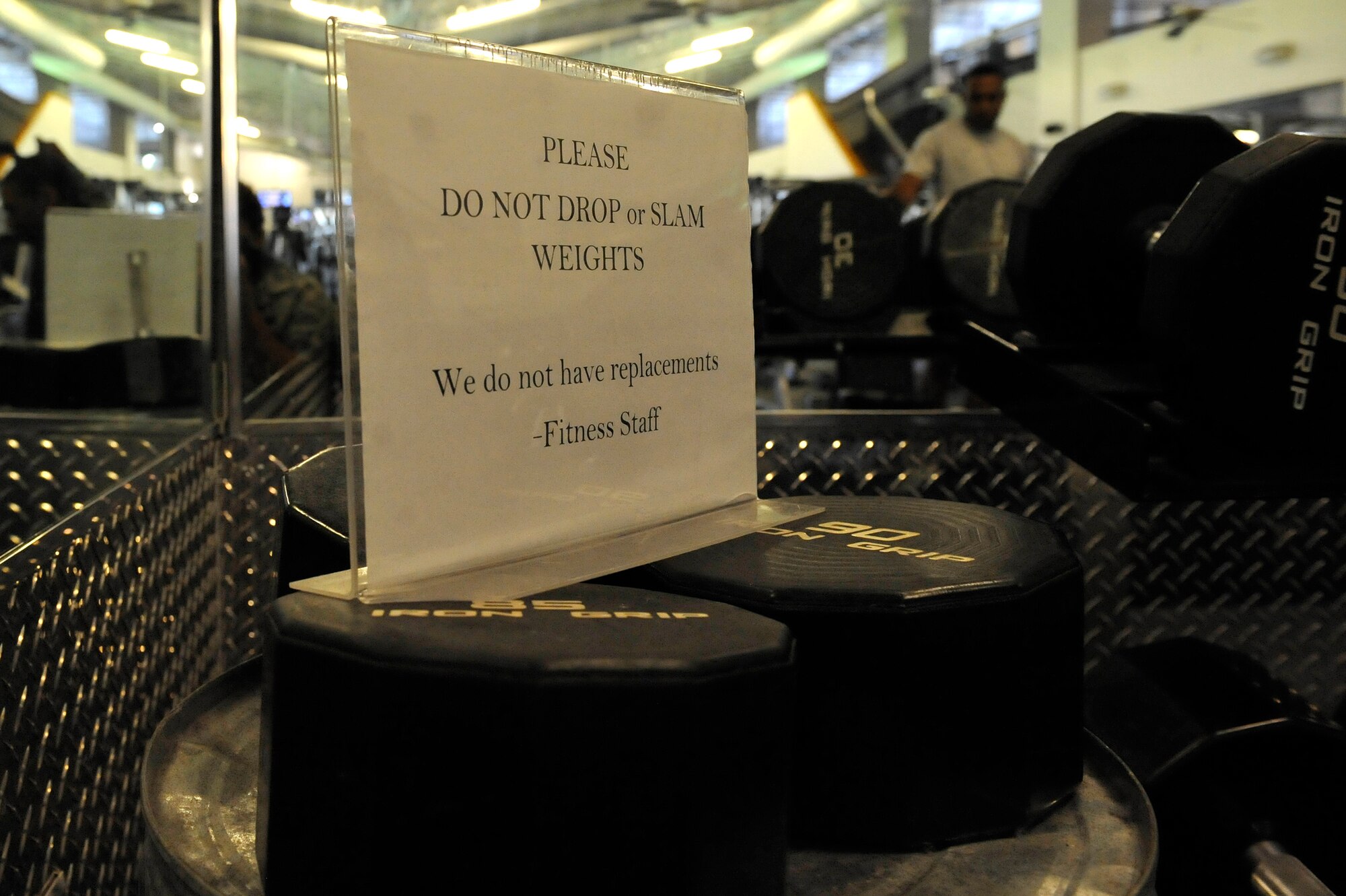 Broken weights are stacked at the Shellbank Fitness Center on Langley Air Force Base, Va., June 1, 2015. Dropping weights and lifting weight that is too heavy can cause irreversible damage to the weights. (U.S. Air Force photo by Senior Airman Breonna Veal/Released)