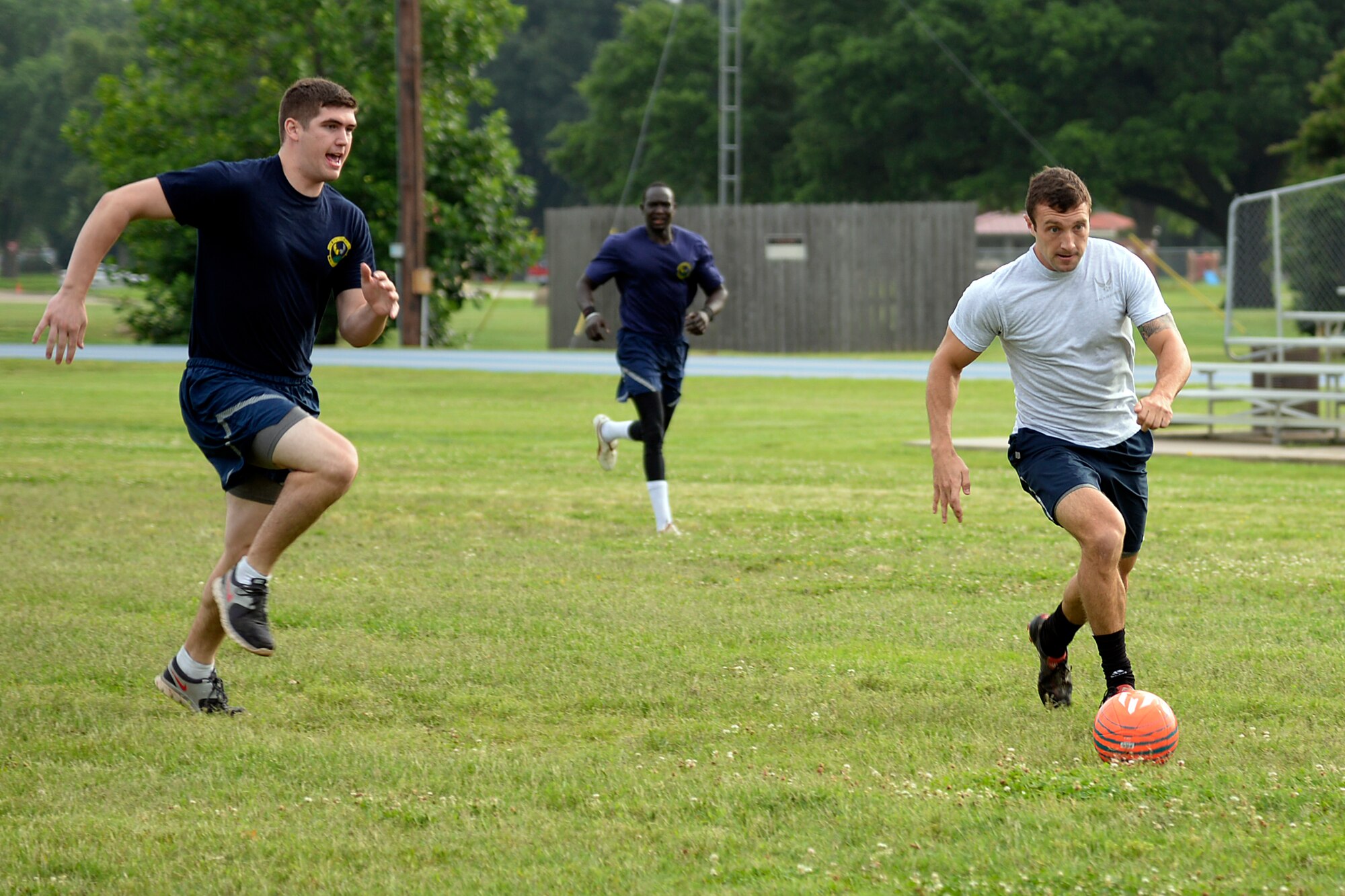 Airmen with the 2nd Logistics Readiness Squadron and 2nd Medical Group compete in a Sports Day soccer game at Barksdale Air Force Base, Louisiana, May 29, 2015. Sports Day is an annual event that gives Airmen the opportunity to participate in several individual and team sports throughout the day. (U.S. Air Force photo/Tech. Sgt. Marie Brown)