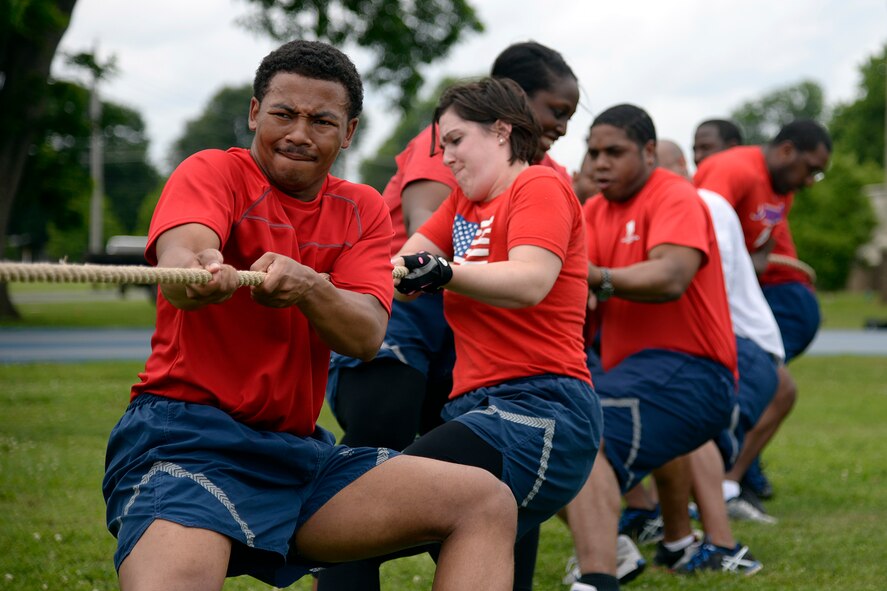 Airmen with the 2nd Force Support Squadron pull a rope during a tug-of-war competition as part of Sports Day at Barksdale Air Force Base, Louisiana, May 29, 2015. Sports Day consisted of various team events including dodgeball, tug-of-war, soccer, volleyball, basketball and a homerun derby. (U.S. Air Force photo/Tech. Sgt. Marie Brown)