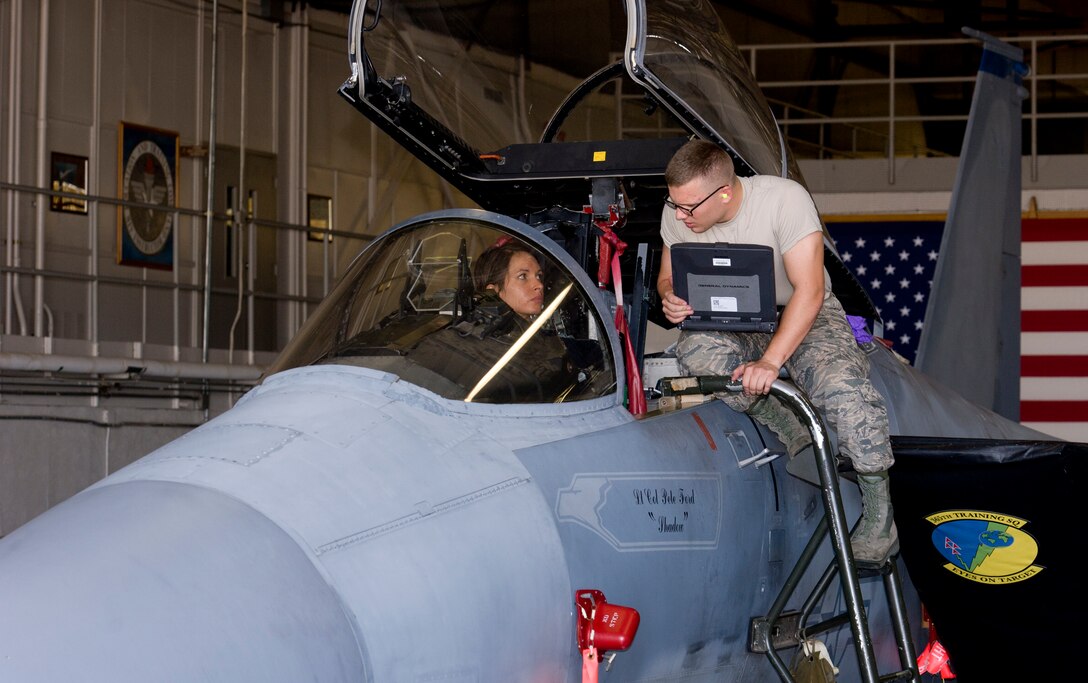 Jennifer Schmidt (left), a new F-15C avionics instructor with the 365th Training Squadron, assisted by avionics student Airman Shannon O'Neil, performs "safe-for-maintenance" checks June 2, 2015 in preparation for her flight control system instructor qualification test at Sheppard Air Force Base, Texas. (U.S. Air Force photo by Danny Webb/Released)
