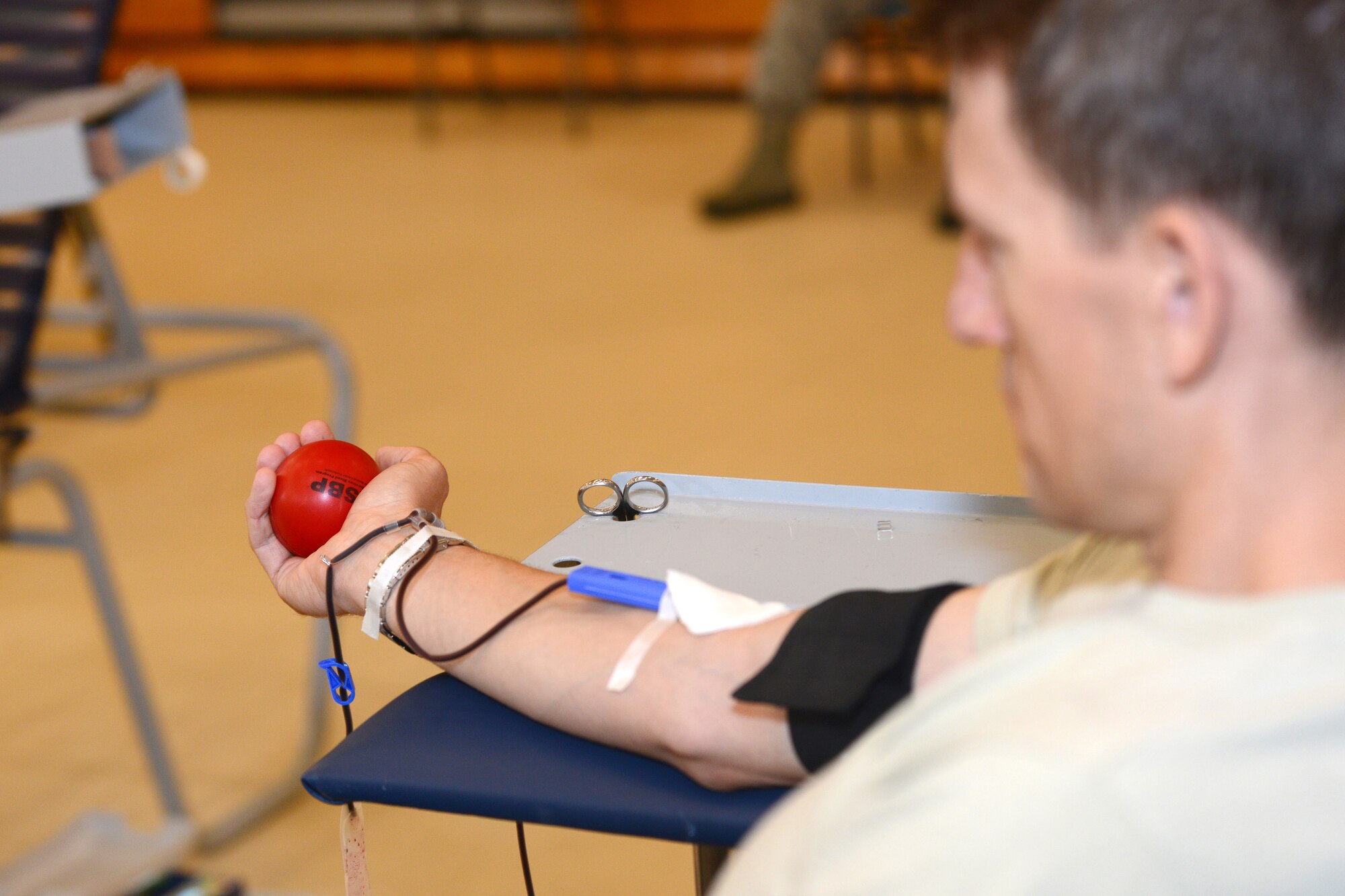 U.S. Air Force Lt. Col. Jimmy Pedany, Air Combat Command Airborne Reconnaissance Operations Branch chief, donates blood during a blood drive at Langley Air Force Base, Va., June 2, 2015. The Armed Services Blood Program aims to provide quality blood products for service members, veterans and their families in both peace and war. (U.S. Air Force photo by Airman 1st Class Devin Scott Michaels/Released)