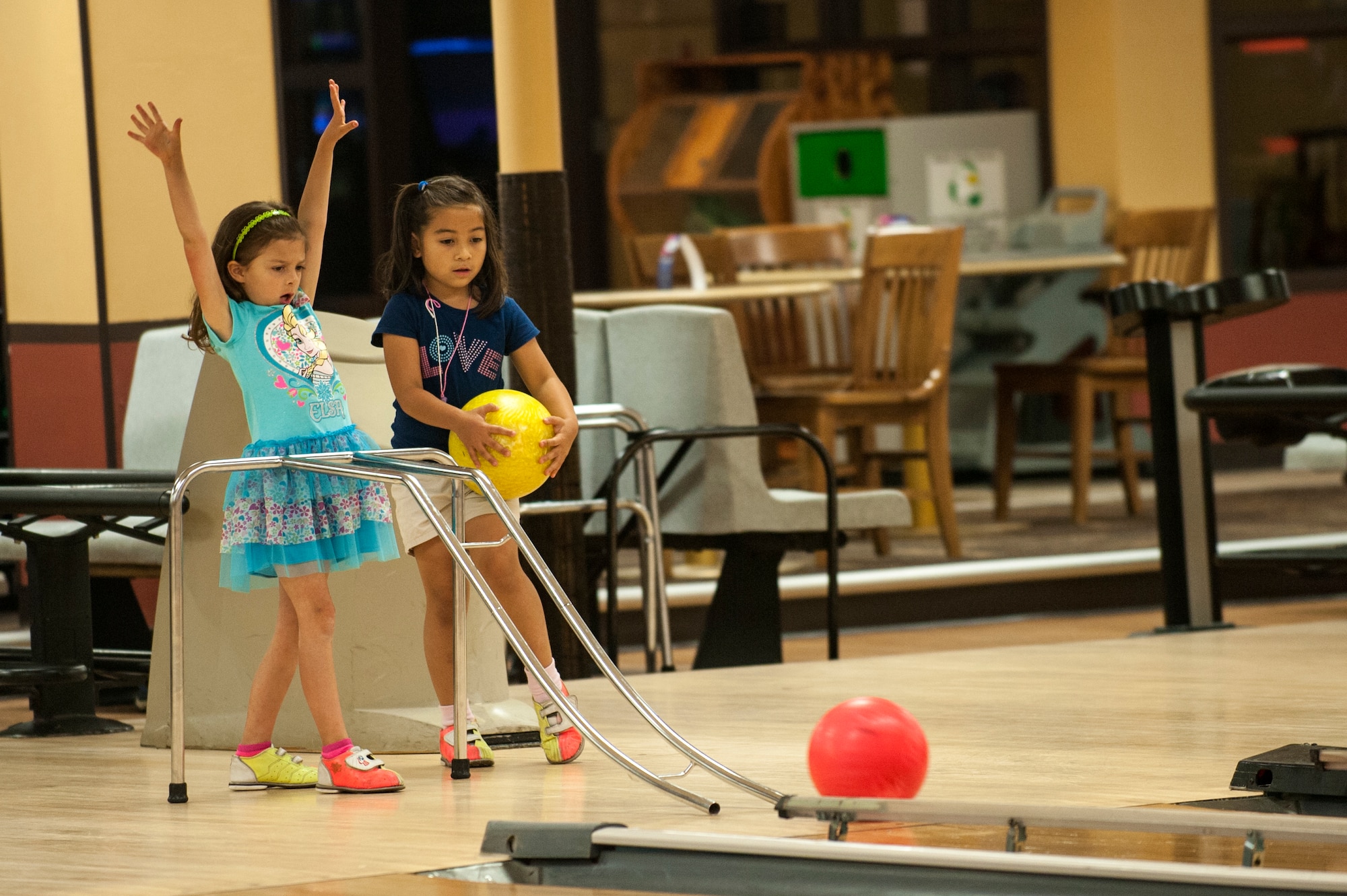 Young members of Team Seymour bowl at the newly renovated Planet Bowl, June 3, 2015, at Seymour Johnson Air Force Base, North Carolina. As part of the Make It Better program, the bowling center received more than $125,000 in renovations and upgrades. (U.S. Air Force photo/Airman Shawna L. Keyes)