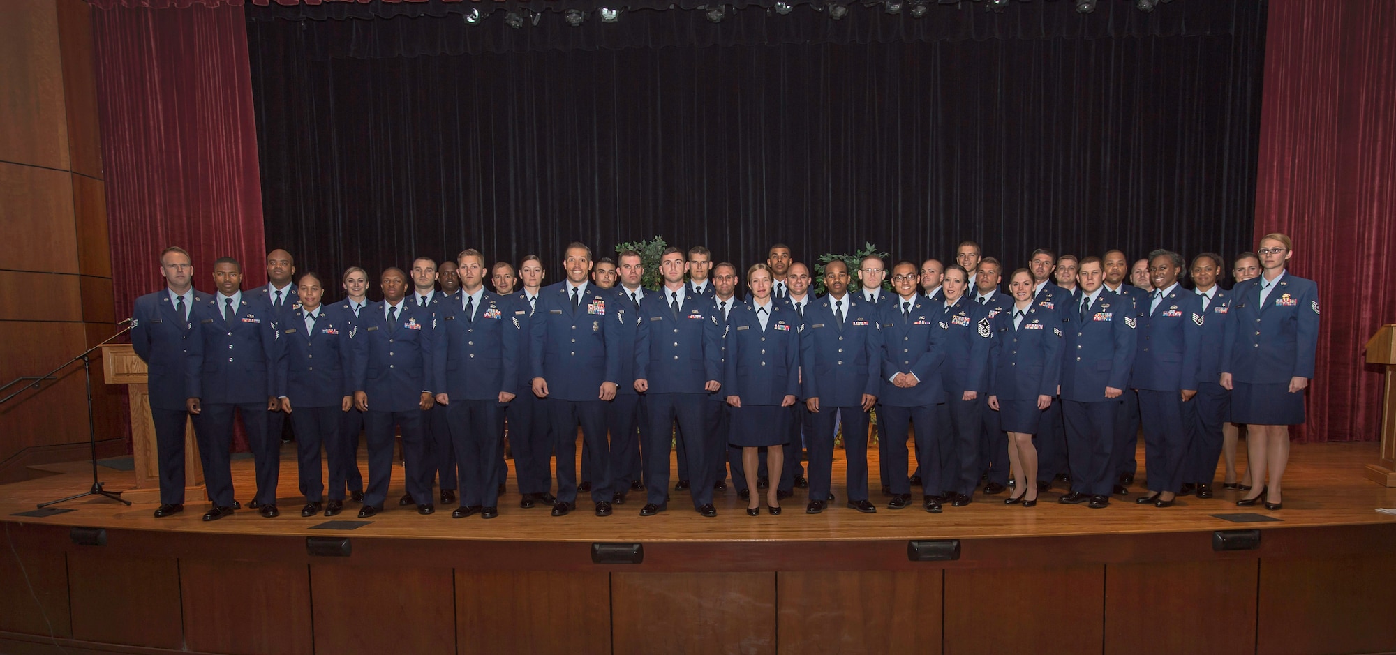 Airmen attending the semi-annual Community College of the Air Force graduation ceremony pose for a group photo June 3, 2015, at Joint Base Charleston, S.C. CCAF was established April 1, 1972 and provides enlisted Airmen a regionally accredited degree through the Air University by the Southern Association of Colleges and Schools. (U.S. Air Force photo/Senior Airman Jared Trimarchi) 