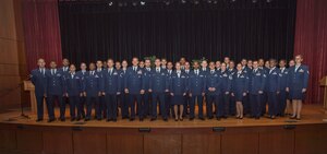 Airmen attending the semi-annual Community College of the Air Force graduation ceremony pose for a group photo June 3, 2015, at Joint Base Charleston, S.C. CCAF was established April 1, 1972 and provides enlisted Airmen a regionally accredited degree through the Air University by the Southern Association of Colleges and Schools. (U.S. Air Force photo/Senior Airman Jared Trimarchi) 