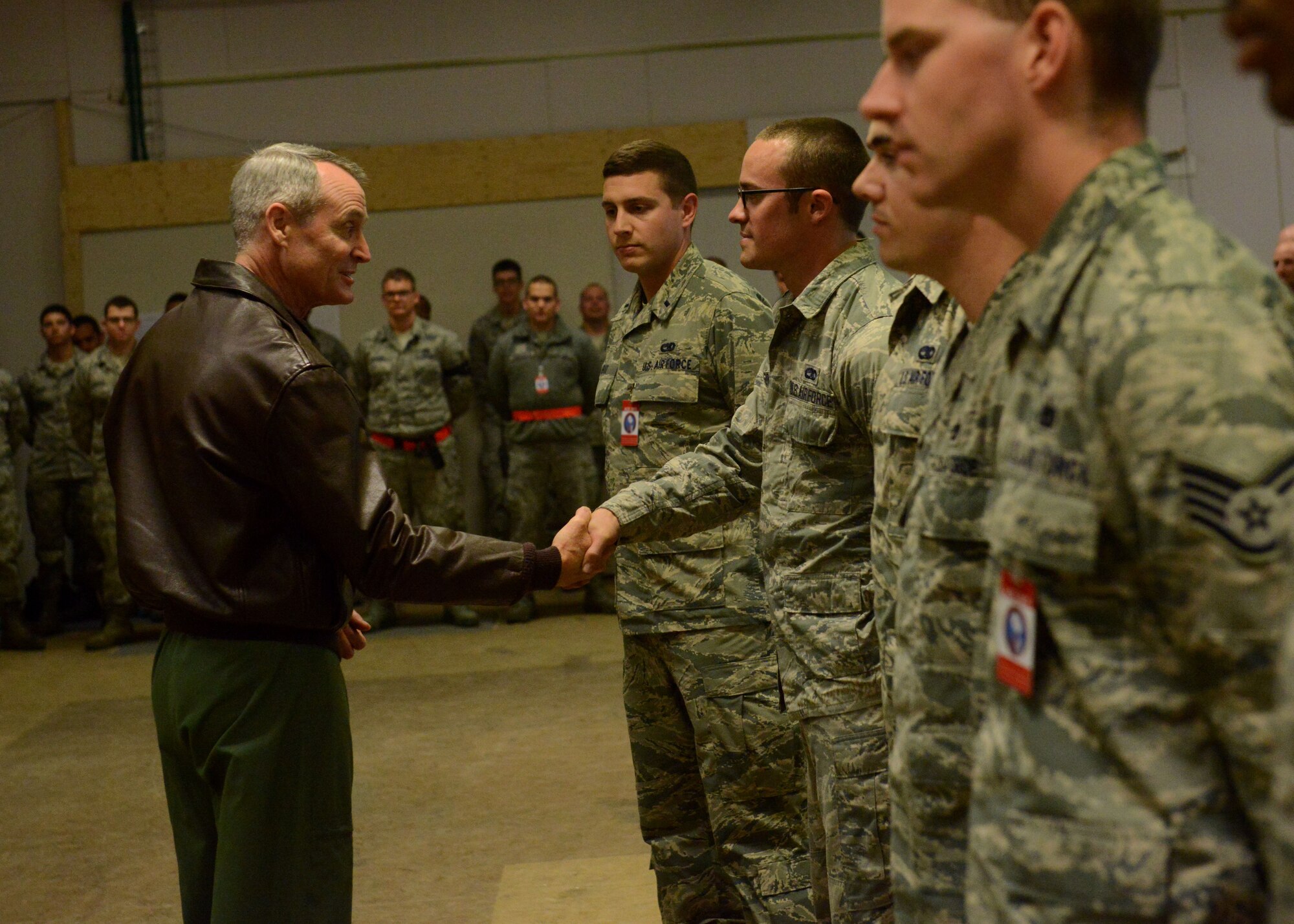 Lt. Gen. Darryl Roberson, 3rd Air Force and 17th Expeditionary Air Force commander, shakes hands with several Airmen from the 31st Fighter Wing at Kallax Air Base, Sweden June 1, 2015.  Roberson thanked Airmen for their hard work during Arctic Challenge Exercise 2015.  During his visit, Roberson was briefed on the exercise, visited Airmen and observed mission takeoffs. (U.S. Air Force photo by Staff Sgt. Evelyn Chavez)