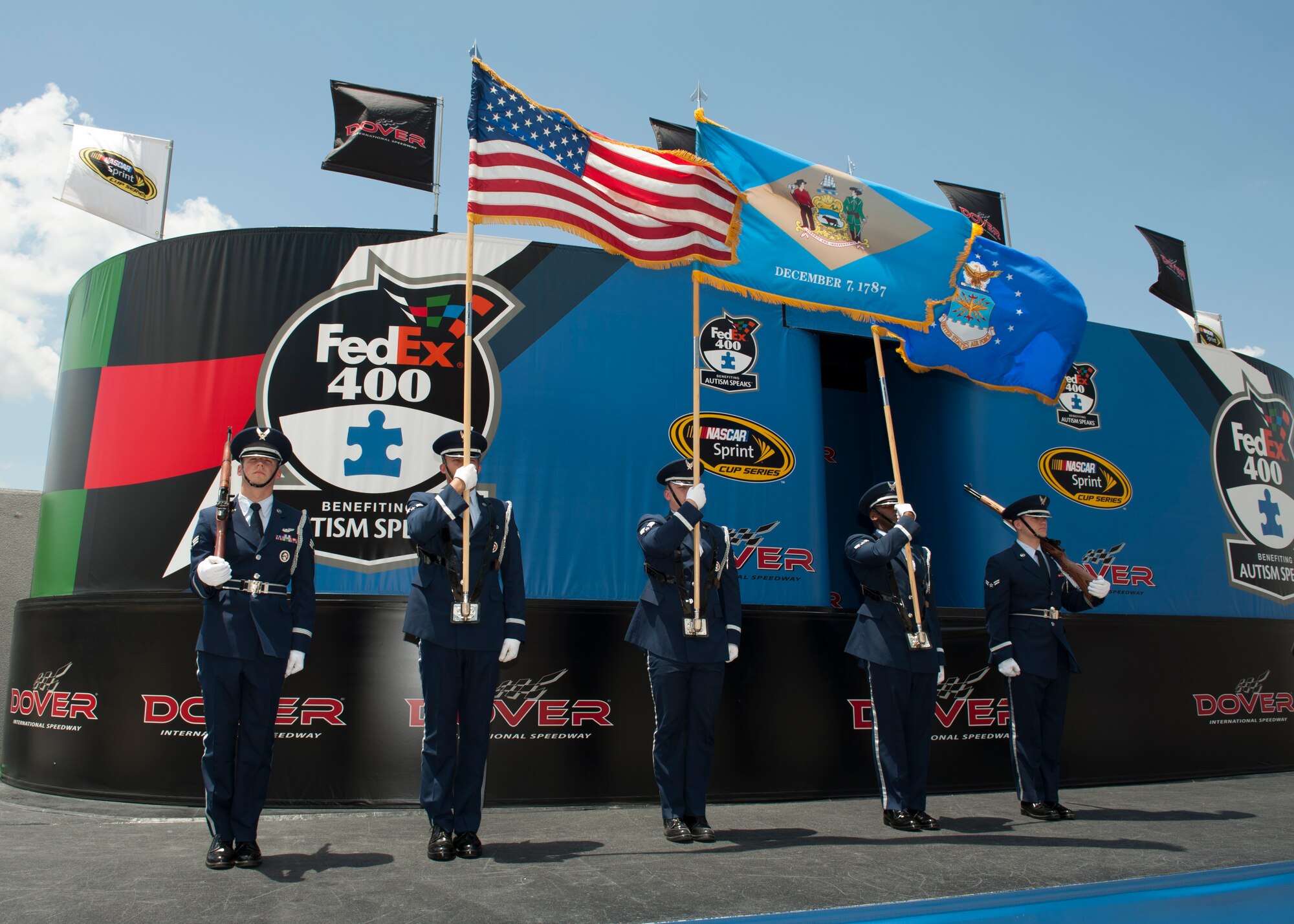 Members of the Dover Air Force Base Honor Guard present colors prior to the start of the FedEx 400 Benefiting Autism Speaks NASCAR race May 31, 2015, at Dover International Speedway in Dover, Del. The Honor Guard also presented colors at the Buckle Up 200 presented by Click It or Ticket, the day prior. (U.S. Air Force photo/Airman 1st Class Zachary Cacicia)