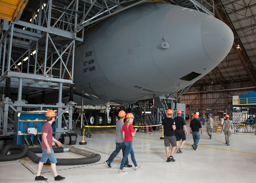BK Racing crew members, including Matt DiBenedetto, driver of the No. 83 Dustless Blasting Toyota, tour the Isochronal Maintenance Dock May 28, 2015, at Dover Air Force Base, Del. The crew members witnessed firsthand the maintenance processes that a C-5M Super Galaxy goes through. (U.S. Air Force photo/Airman 1st Class Zachary Cacicia)