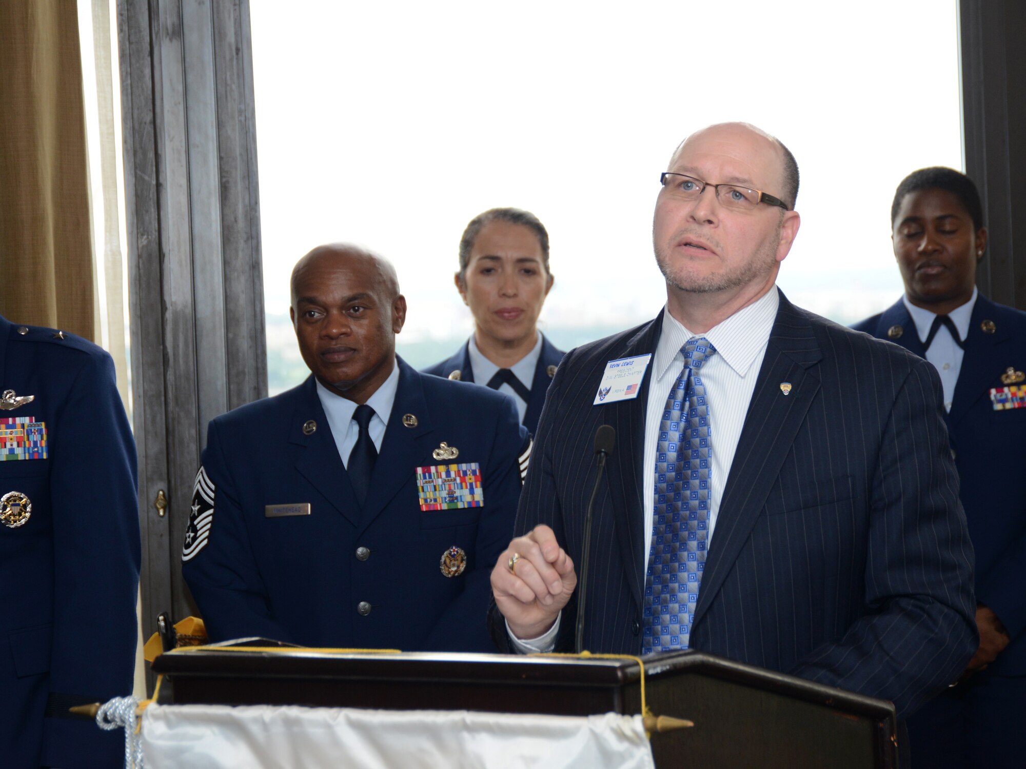 Kevin Lewis, president of the Air Force Association's D. W. Steele Sr. Memorial Chapter, thanks Air National Guard members at the 13th annual AFA Salute to the Air National Guard, held June 1 in Arlington, Virginia. The AFA honored 16 ANG members across a broad range of specialties for their dedication and outstanding contributions to the success of the ANG and the overall Air Force mission. (US Air National Guard photo by Staff Sgt. John E. Hillier/Released)