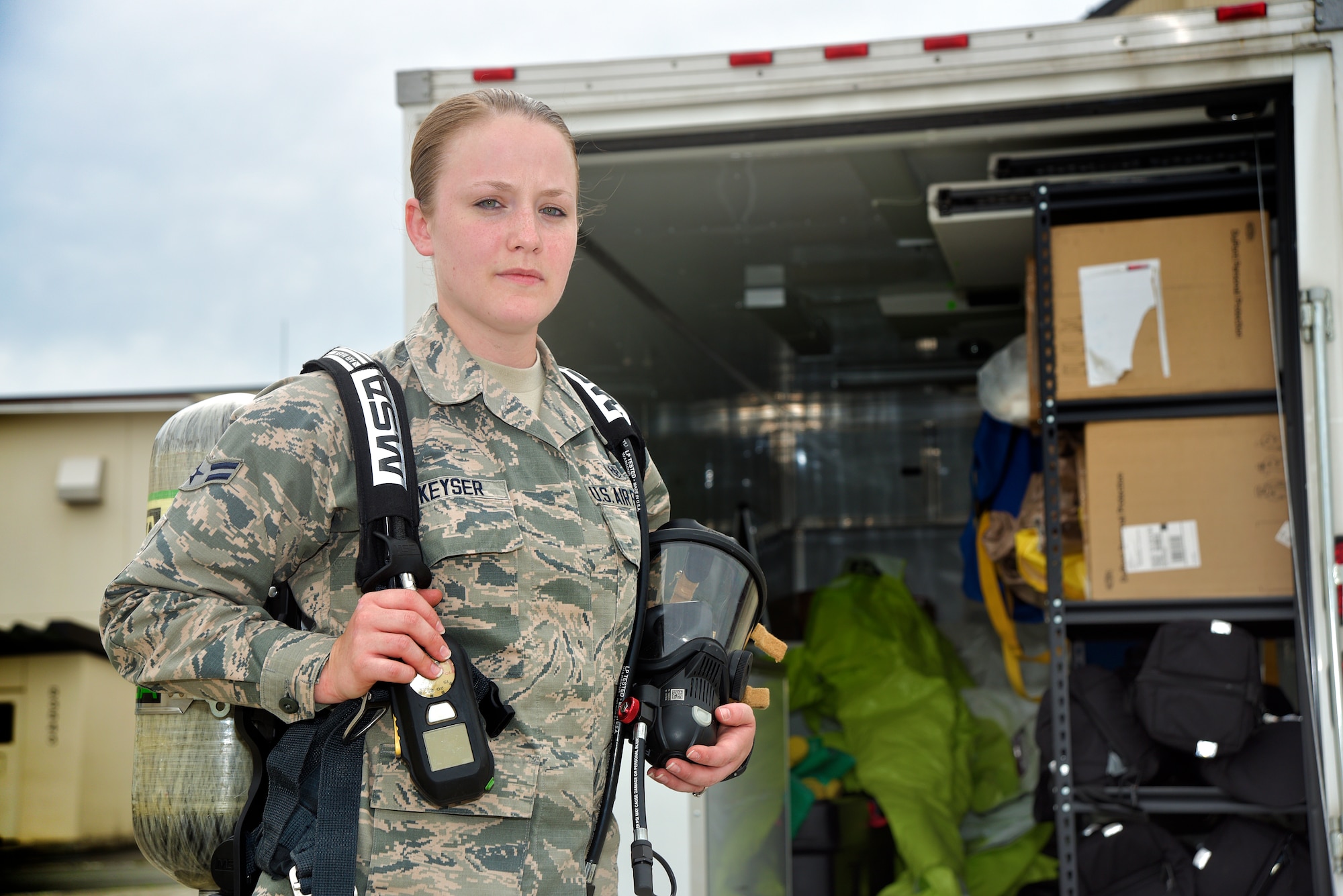 U.S. Air Force Airman 1st Class Ann Keyser, stands with her bioenvironmental equipment at Misawa Air Base, Japan, June, 2, 2015. Ann was selected as Misawa's Wild Weasel of the Week for her dedication to promoting the health and well-being of all Air Force personnel and ensuring workers in all environments are protected from any hazards they may come in contact with. (U.S. Air Force photo by Senior Airman Jose L. Hernandez-Domitilo/Released)