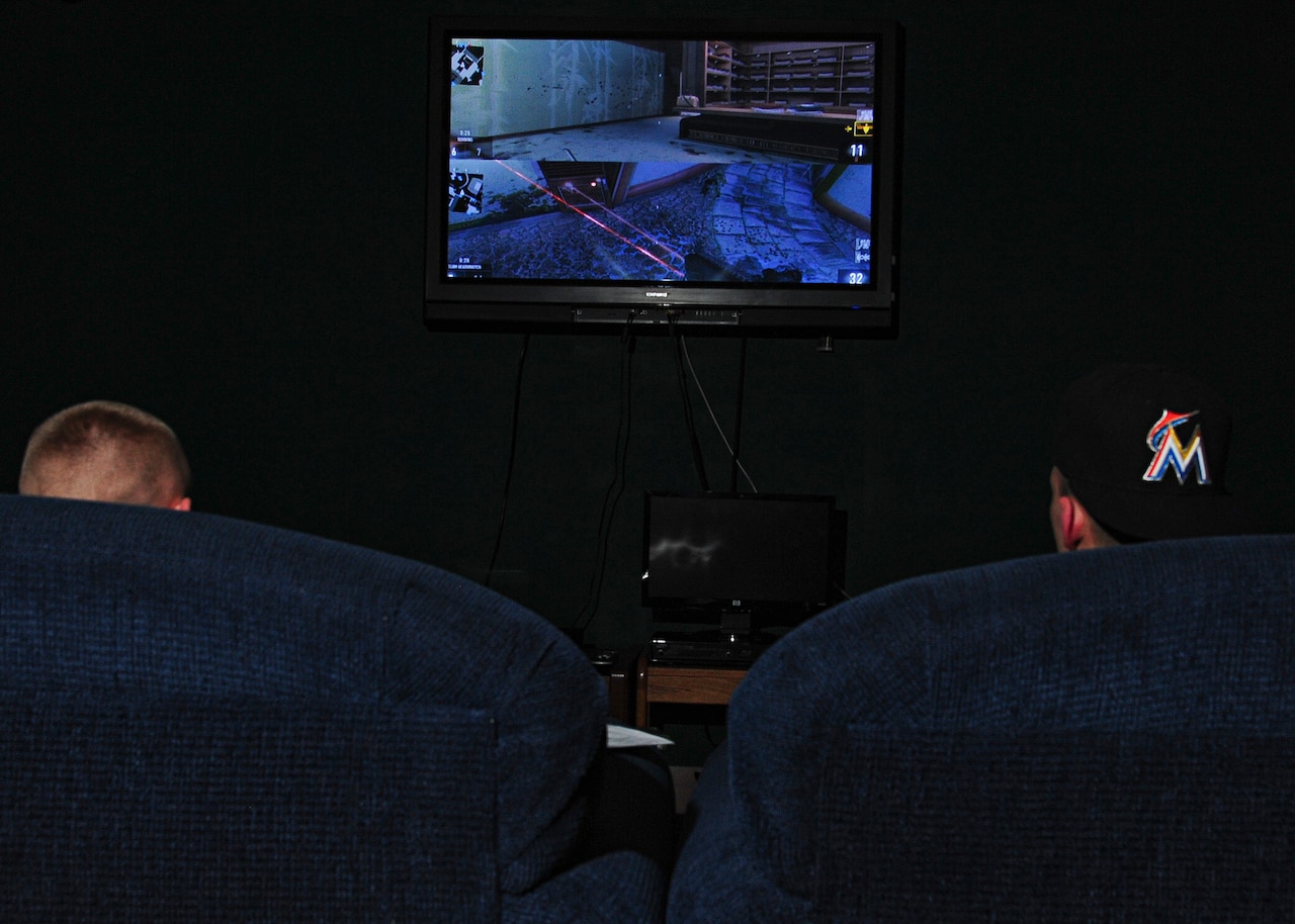 Airmen from the 319th Air Base Wing at Grand Forks Air Force Base, N.D., play an interactive video game in their dormitory dayroom, May 28, 2015. Gaming has become a popular way for Grand Forks airmen to connect outside of duty hours, providing an alternative to outside activities that require good weather. U.S. Air Force photo by Airman 1st Class Ryan Sparks