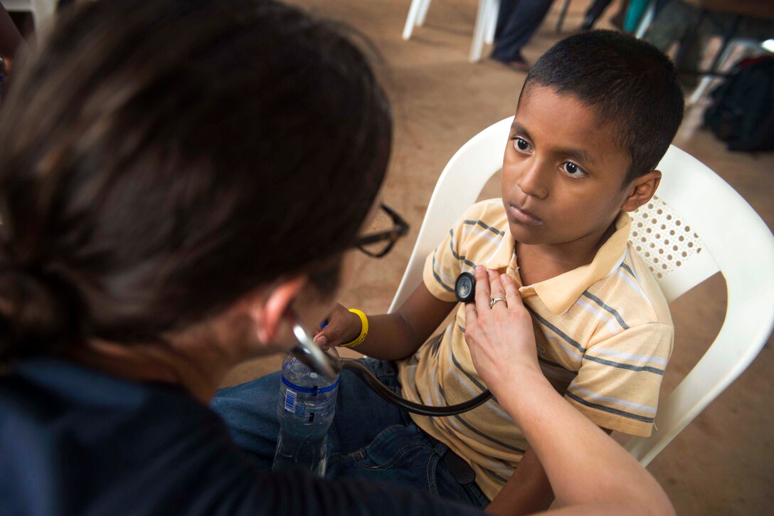 U.S. Navy Lt. Cmdr. Melissa Buryk examines a patient at a medical site in Puerto Cabezas, Nicaragua, May 22, 2015, during Continuing Promise 2015. Buryk is a pediatrician assigned to Naval Medical Center Portsmouth, Va. Continuing Promise is a U.S. Southern Command-sponsored deployment to conduct civil-military operations and show U.S. support and commitment to Central and South America and the Caribbean.