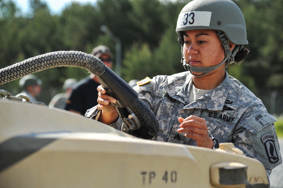U.S. Army Sgt. Dianne Duran inspects equipment for deficiencies during an air assault training course on the 7th Army Joint Multinational Training Command's Grafenwoehr Training Area, Germany, June 3, 2015. Duran is a paratrooper assigned to the 173rd Airborne Brigade.
