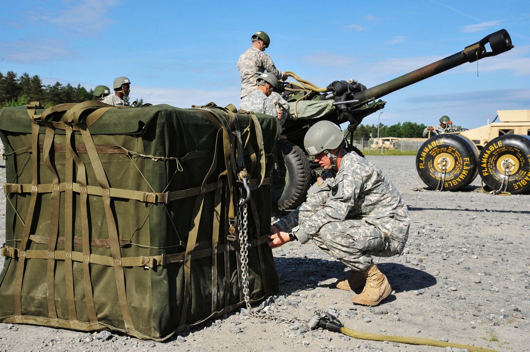U.S. soldiers inspect training equipment during an air assault course on the 7th Army Joint Multinational Training Command's Grafenwoehr Training Area, Germany, June 3, 2015.