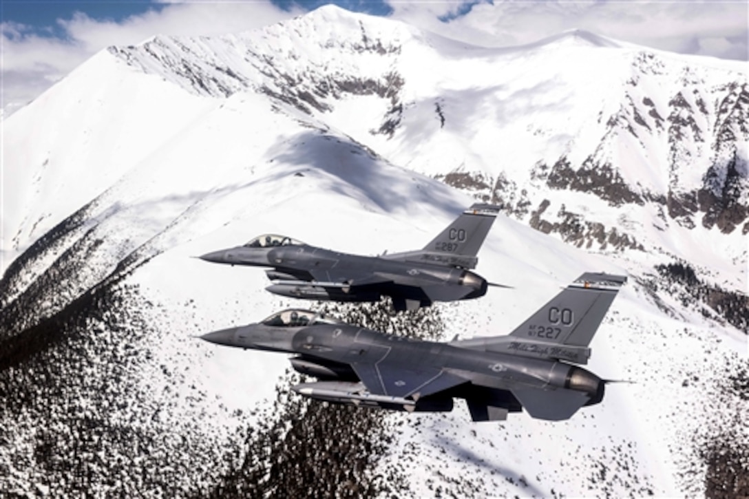 Air Force F-16 Fighting Falcons fly over the Rocky Mountains in Colorado, May 29, 2015, during a mission around the state. The pilots and aircraft are assigned to the Colorado Air National Guard's 120th Fighter Squadron.