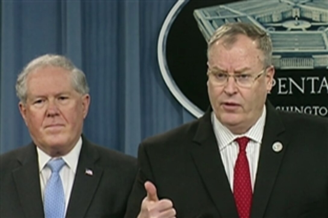 Deputy Defense Secretary Bob Work discusses a review of the department's laboratory procedures, processes and protocols associated with inactivating spore-forming anthrax during a briefing at the Pentagon, June 3, 2015. Frank Kendall, left, undersecretary of defense for acquisition, technology and logistics, participated in the news conference.