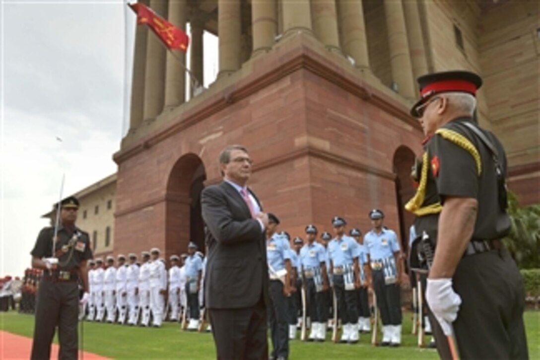 U.S. Defense Secretary Ash Carter, center, observes an honor cordon to welcome him to India's Defense Ministry in New Delhi, June 3, 2015.