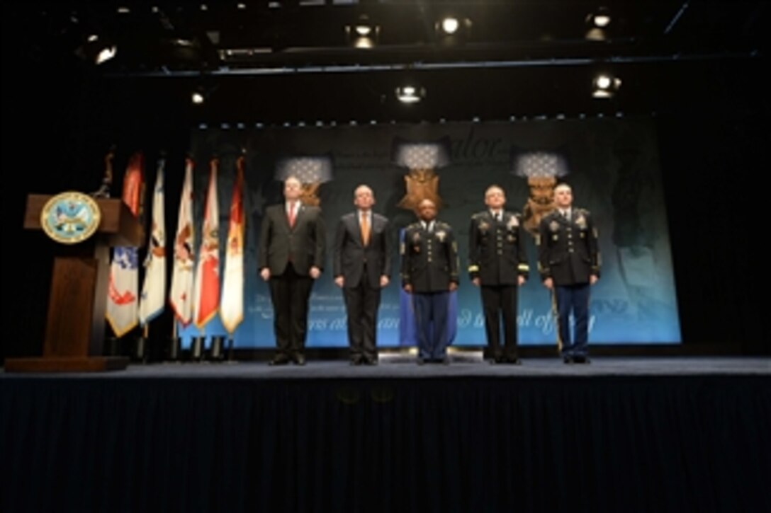Deputy Secretary of Defense Bob Work, left, stands with distinguished guests during a ceremony inducting Medal of Honor recipients Army Pvt. Henry Johnson and Army Sgt. William Shemin into the Hall of Heroes at the Pentagon, June 3, 2015. 