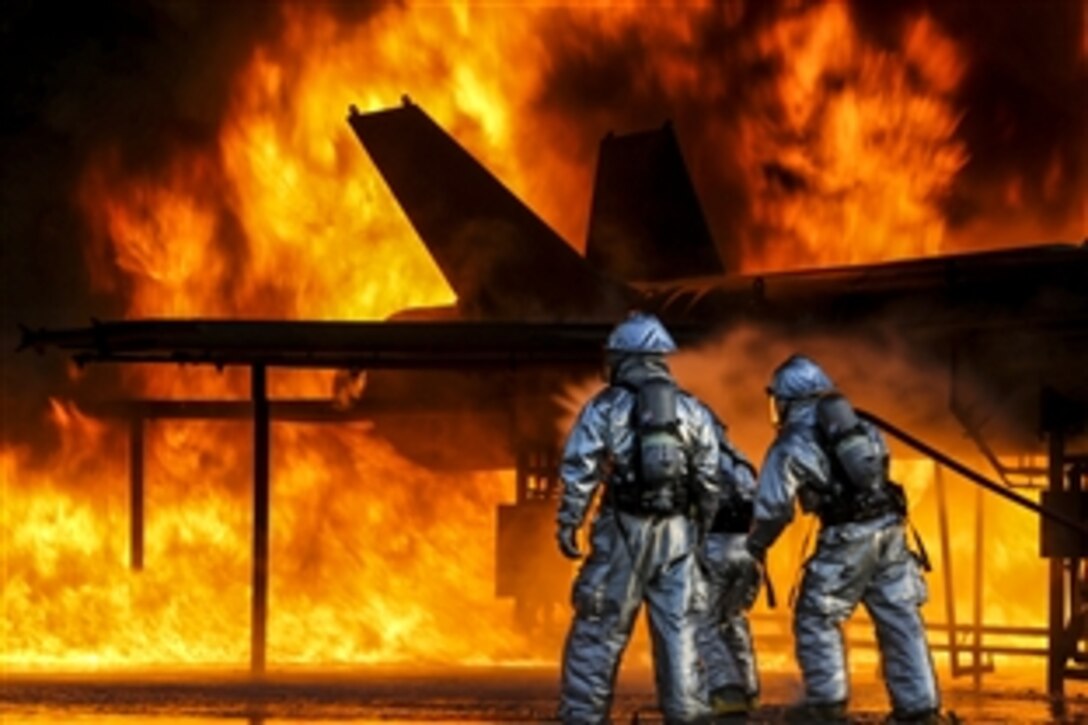 Marines battle a fire during emergency preparedness training on Marine Corps Air Station Beaufort, S.C., May 28, 2015. The Marines are assigned to the station’s Headquarters Squadron.