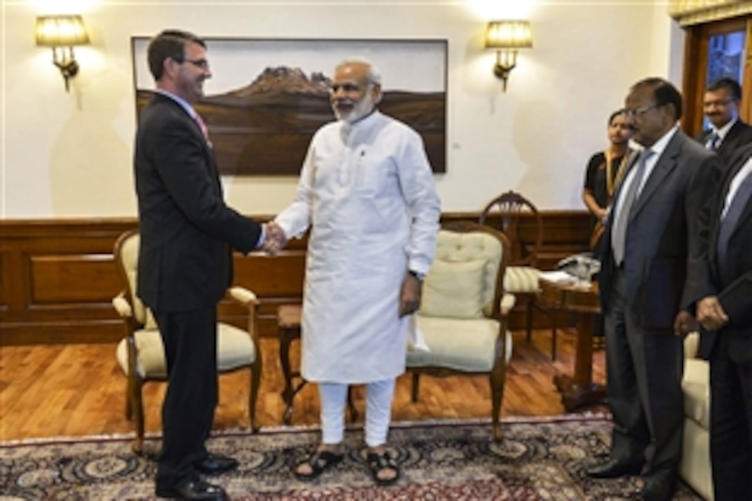 U.S. Defense Secretary Ash Carter, left, shakes hands with Indian Prime Minister Narendra Modi in New Delhi, June 3, 2015. Carter is on a 10-day trip to meet with partner nations and affirm U.S. commitment in the Asia-Pacific region.