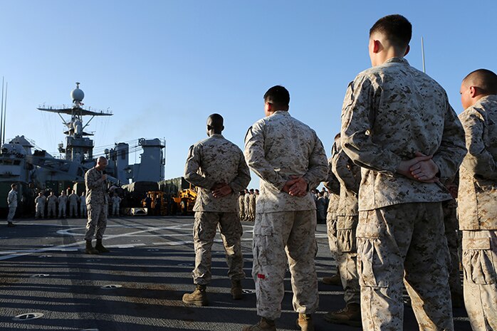 First Sgt. John Beckett, the company first sergeant for Kilo Company, Battalion Landing Team 3rd Battalion, 6th Marine Regiment, 24th Marine Expeditionary Unit, speaks to the graduating Marines during a Corporal’s Leadership Course graduation aboard the USS Fort McHenry (LSD 43), April 4, 2015. The 24th MEU is embarked on the ships of the Iwo Jima Amphibious Ready Group and deployed to maintain regional security in the U.S. 5th Fleet area of operations.  (U.S. Marine Corps photo by Sgt. Devin Nichols)
