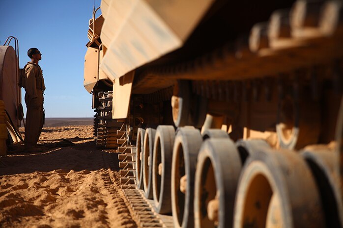 An amphibious assault vehicle crewman with Kilo Company, Battalion Landing Team 3rd Battalion, 6th Marine Regiment, 24th Marine Expeditionary Unit, prepares to refuel an AAV, as the unit readies itself for Exercise Eager Lion 2015 in Jordan, May 3, 2015. Eager Lion is a recurring multinational exercise designed to strengthen military-to-military relationships, increase interoperability between partner nations, and enhance regional security and stability. The 24th MEU is embarked on the ships of the Iwo Jima Amphibious Ready Group and deployed to maintain regional security in the U.S. 5th Fleet area of operations. (U.S. Marine Corps photo by Lance Cpl. Austin A. Lewis/Released)