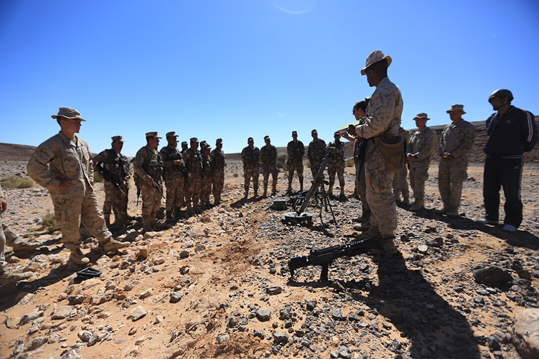 150505-M-WA276-035: JORDAN (May 5, 2015) Marines with Kilo Company, Battalion Landing Team 3rd Battalion, 6th Marine Regiment, 24th Marine Expeditionary Unit, discuss capabilities of the M249 Squad Automatic Weapon and the M224A1 60 mm mortar system to Jordanian soldiers before conducting bilateral live-fire training as part of Exercise Eager Lion 2015 in Jordan, May 5, 2015. Eager Lion is a recurring multinational exercise designed to strengthen military-to-military relationships, between partner nations and enhance regional security and stability. The 24th MEU is embarked on the ships of the Iwo Jima Amphibious Ready Group and deployed to maintain regional security in the U.S. 5th Fleet area of operations. (U.S. Marine Corps photo by Lance Cpl. Dani A. Zunun/Released)