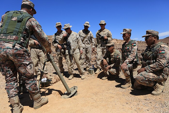 150505-M-AW276-074: JORDAN (May 5, 2015) Jordanian soldiers discuss capabilities of their 60 mm mortar system to U.S. Marines with Kilo Company, Battalion Landing Team 3rd Battalion, 6th Marine Regiment, 24th Marine Expeditionary Unit, before conducting bilateral live-fire training as part of Exercise Eager Lion 2015 in Jordan, May 5, 2015. Eager Lion is a recurring multinational exercise designed to strengthen military-to-military relationships, between partner nations and enhance regional security and stability. The 24th MEU is embarked on the ships of the Iwo Jima Amphibious Ready Group and deployed to maintain regional security in the U.S. 5th Fleet area of operations. (U.S. Marine Corps photo by Lance Cpl. Dani A. Zunun/Released)