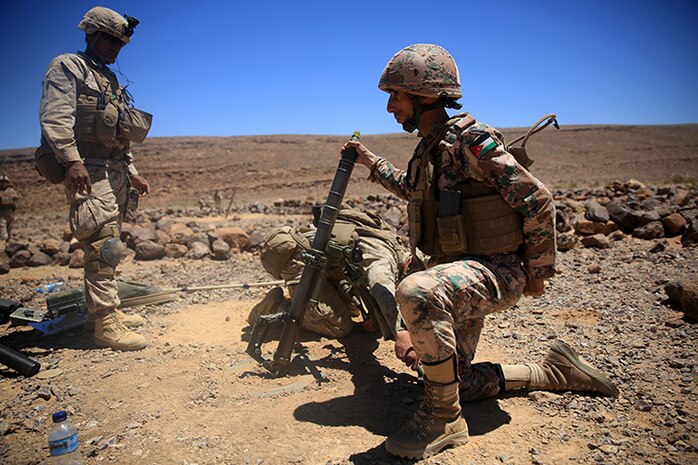 150505-M-WA276-175: JORDAN (May 5, 2015) Staff Sgt. Martin Pallares, left, the mortar section leader with Kilo Company, Battalion Landing Team 3rd Battalion, 6th Marine Regiment, 24th Marine Expeditionary Unit, observes a Jordanian soldier preparing to fire the M224A1 60 mm mortar during bilateral live-fire training as part of Exercise Eager Lion 2015 in Jordan, May 5, 2015. Eager Lion is a recurring multinational exercise designed to strengthen military-to-military relationships, between partner nations and enhance regional security and stability. The 24th MEU is embarked on the ships of the Iwo Jima Amphibious Ready Group and deployed to maintain regional security in the U.S. 5th Fleet area of operations. (U.S. Marine Corps photo by Lance Cpl. Dani A. Zunun/Released)
