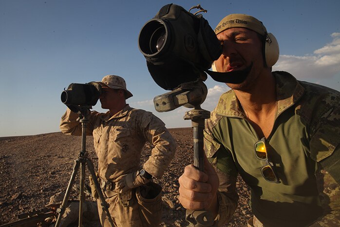 Corporal Drew Eyre, left, a scout sniper with Weapons Company, Battalion Landing Team 3rd Battalion, 6th Marine Regiment, 24th Marine Expeditionary Unit, and Italian Marine Lance Cpl. Bataccia Angelo provide spotting duties during a bilateral live-fire exercise  as part of Exercise Eager Lion 2015 in Jordan, May 7, 2015. Eager Lion is a recurring multinational exercise designed to strengthen military-to-military relationships, increase interoperability between partner nations, and enhance regional security and stability. The 24th MEU is embarked on the ships of the Iwo Jima Amphibious Ready Group and deployed to maintain regional security in the U.S. 5th Fleet area of operations. (U.S. Marine Corps photo by Lance Cpl. Austin A. Lewis/Released)