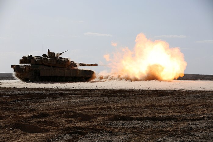 An M1A1 Abrams Main Battle Tank with Kilo Company, Battalion Landing Team 3rd Battalion, 6th Marine Regiment, 24th Marine Expeditionary Unit, fires its 120 mm smoothbore cannon during a live-fire event as part of Exercise Eager Lion 2015 in Jordan, May 9, 2015. Eager Lion is a recurring multinational exercise designed to strengthen military-to-military relationships, increase interoperability between partner nations, and enhance regional security and stability. The 24th MEU is embarked on the ships of the Iwo Jima Amphibious Ready Group and deployed to maintain regional security in the U.S. 5th Fleet area of operations. (U.S. Marine Corps photo by Sgt. Devin Nichols)
