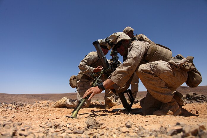 Mortarmen with Kilo Company, Battalion Landing Team 3rd Battalion, 6th Marine Regiment, 24th Marine Expeditionary Unit, conduct M224A1 60 mm mortar firing procedures during a simulated platoon assault as part of Exercise Eager Lion 2015 in Jordan, May 9, 2015. Eager Lion is a recurring multinational exercise designed to strengthen military-to-military relationships, increase interoperability between partner nations, and enhance regional security and stability. The 24th MEU is embarked on the ships of the Iwo Jima Amphibious Ready Group and deployed to maintain regional security in the U.S. 5th Fleet area of operations. (U.S. Marine Corps photo by Lance Cpl. Austin A. Lewis/Released)