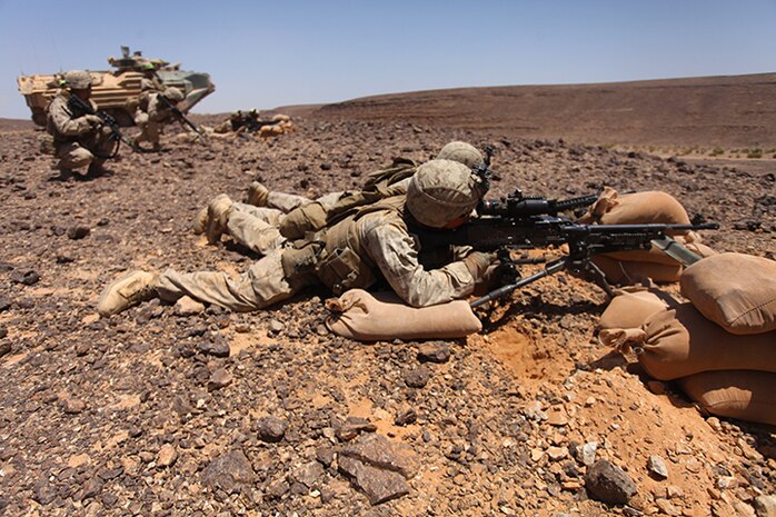 Marines with Kilo Company, Battalion Landing Team 3rd Battalion, 6th Marine Regiment, 24th Marine Expeditionary Unit, participate in a simulated platoon assault as part of Exercise Eager Lion 2015 in Jordan, May 9, 2015. Eager Lion is a recurring multinational exercise designed to strengthen military-to-military relationships, increase interoperability between partner nations, and enhance regional security and stability. The 24th MEU is embarked on the ships of the Iwo Jima Amphibious Ready Group and deployed to maintain regional security in the U.S. 5th Fleet area of operations. (U.S. Marine Corps photo by Lance Cpl. Austin A. Lewis/Released)