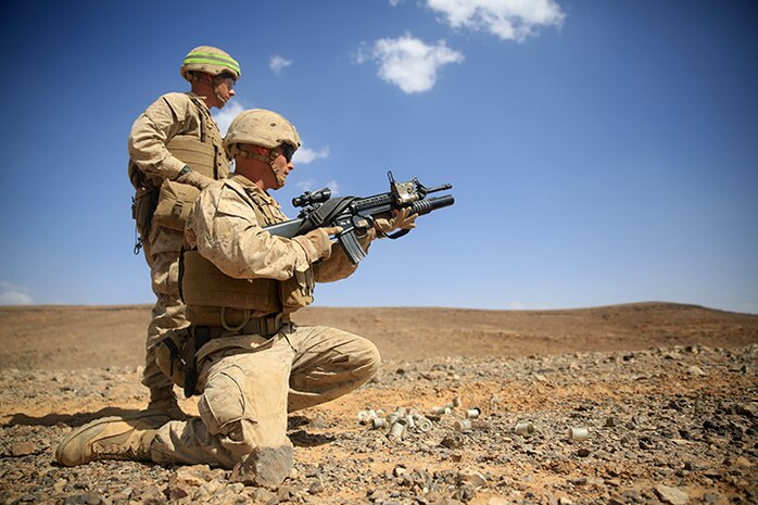 1505014-M-WA276-254: JORDAN (May 14, 2015) Lance Cpl. James Harris, a rifleman with Kilo Company, Battalion Landing Team 3rd Battalion, 6th Marine Regiment, 24th Marine Expeditionary Unit, loads a 40 mm practice round into an M203 Grenade Launcher before conducting a live-fire exercise, as part of Exercise Eager Lion 2015, in Jordan, May 14, 2015. Eager Lion is a recurring multinational exercise designed to strengthen military-to-military relationships, between partner nations and enhance regional security and stability. The 24th MEU is embarked on the ships of the Iwo Jima Amphibious Ready Group and deployed to maintain regional security in the U.S. 5th Fleet area of operations. (U.S. Marine Corps photo by Lance Cpl. Dani A. Zunun)