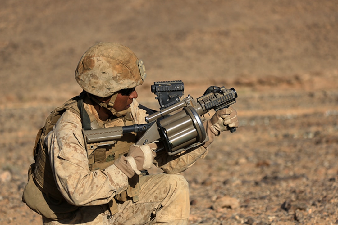 1505014-M-WA276-566: JORDAN (May 14, 2015) Cpl. Juan Hernandez, a small arms technician with Combat Logistics Battalion 24, 24th Marine Expeditionary Unit, prepares to fire an M32 Multi-shot Grenade Launcher, during a live-fire exercise, as part of Exercise Eager Lion 2015, in Jordan, May 14, 2015. Eager Lion is a recurring multinational exercise designed to strengthen military-to-military relationships, between partner nations and enhance regional security and stability. The 24th MEU is embarked on the ships of the Iwo Jima Amphibious Ready Group and deployed to maintain regional security in the U.S. 5th Fleet area of operations. (U.S. Marine Corps photo by Lance Cpl. Dani A. Zunun)