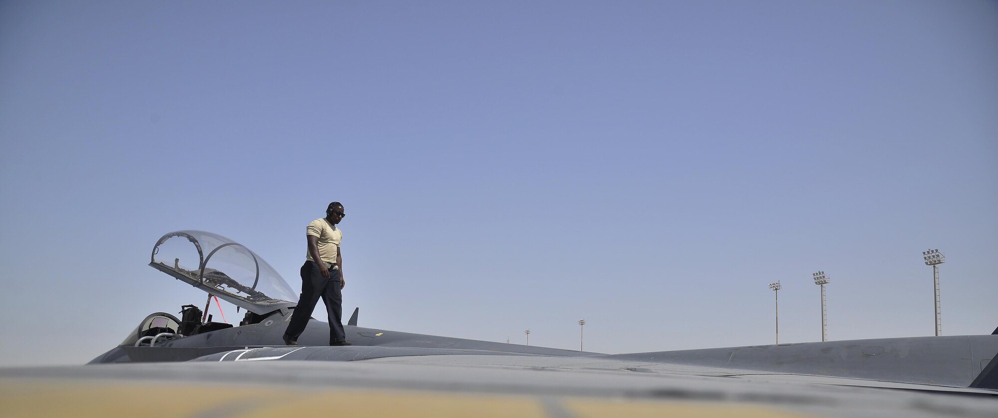 Staff Sgt. Oren checks panels for damage during a pre-launch inspection on top of an F-15E Strike Eagle at an undisclosed location in Southwest Asia May 31, 2015. Sgt. Oren is a dedicated crew chief assigned to the 380th Expeditionary Aircraft Maintenance Squadron. (U.S. Air Force photo/Tech. Sgt. Christopher Boitz) 