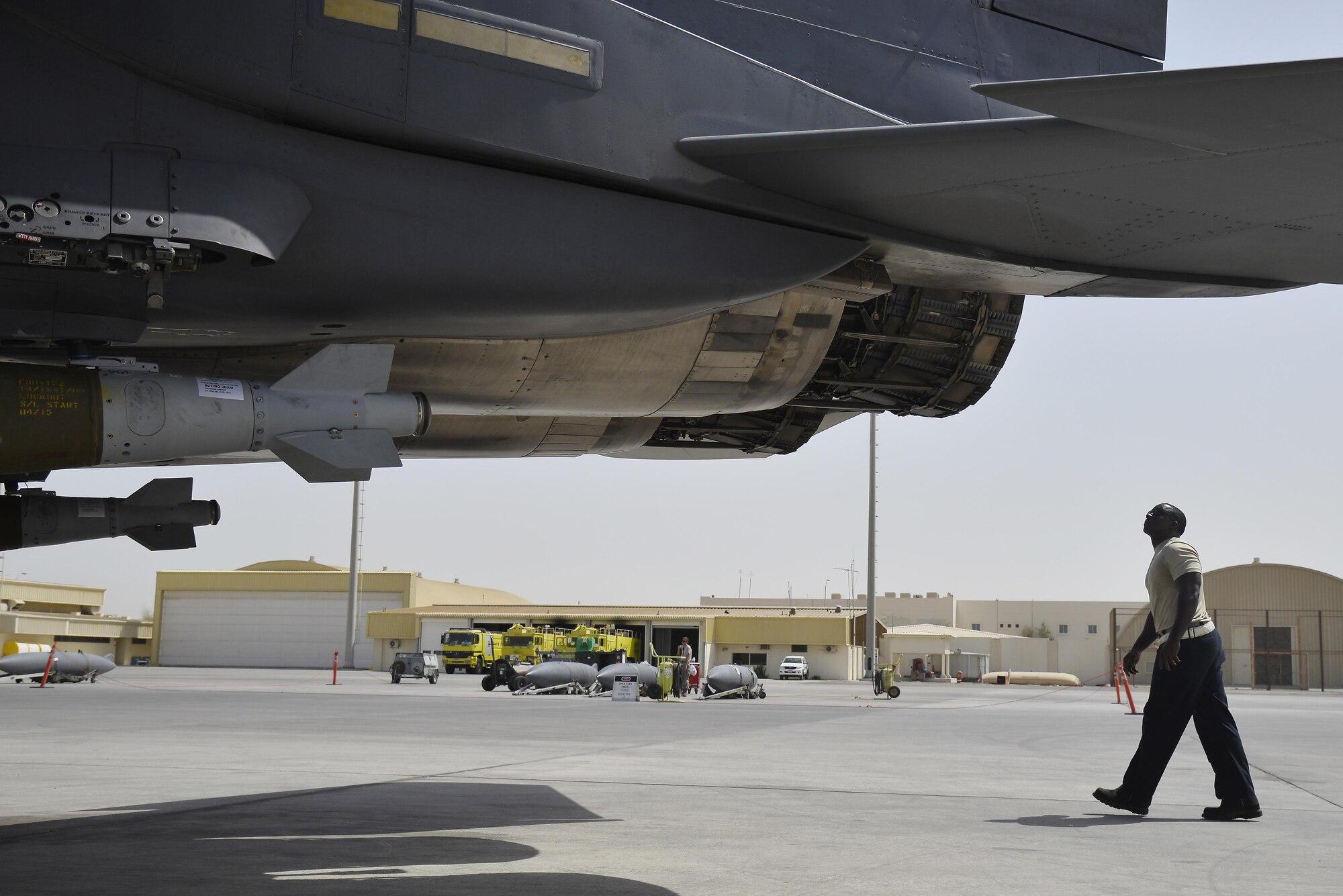 Staff Sgt. Oren performs a visual inspection of an F-15E Strike Eagle exhaust during a pre-launch inspection at an undisclosed location in Southwest Asia May 31, 2015. Sgt. Oren is a dedicated crew chief assigned to the 380th Expeditionary Aircraft Maintenance Squadron. (U.S. Air Force photo/Tech. Sgt. Christopher Boitz) 