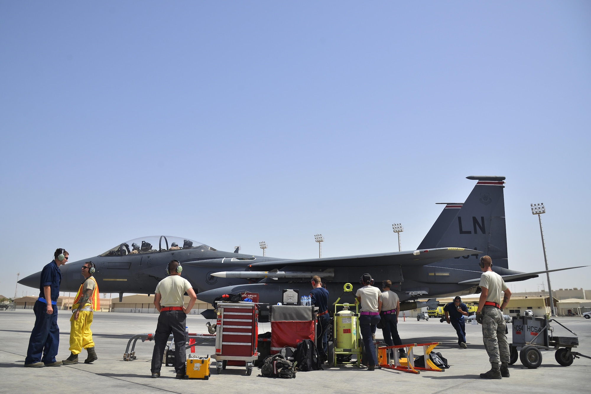 Members of the 380th Expeditionary Aircraft Maintenance Squadron conduct end of runway procedures on an F-15E Strike Eagle at an undisclosed location in Southwest Asia May 31, 2015. End of runway procedures enable the jet to fly and drop weapons. (U.S. Air Force photo/Tech. Sgt. Christopher Boitz) 