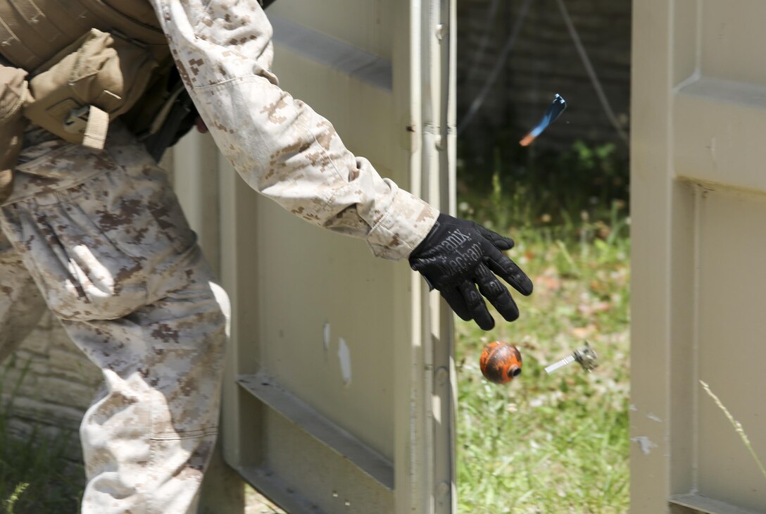 Marines with Company E, Battalion Landing Team 2/6 conduct military operations in urban terrain (MOUT) training at Mobile MOUT aboard Marine Corps Base Camp Lejeune, N.C. May 28, 2015. During the training, the Marines practiced patrolling, established vehicle checkpoints, and conducted  assault drills during day and night operations. (Photo by Staff Sgt. Bobby J. Yarbrough)