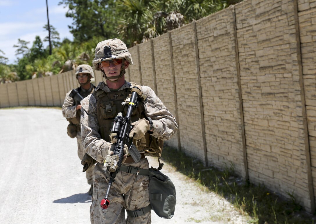 Marines with Company E, Battalion Landing Team 2/6 conduct military operations in urban terrain (MOUT) training at Mobile MOUT aboard Marine Corps Base Camp Lejeune, N.C., May 28, 2015. During the training, the Marines practiced patrolling, established vehicle checkpoints, and conducted  assault drills during day and night operations. (Photo by Staff Sgt. Bobby J. Yarbrough)