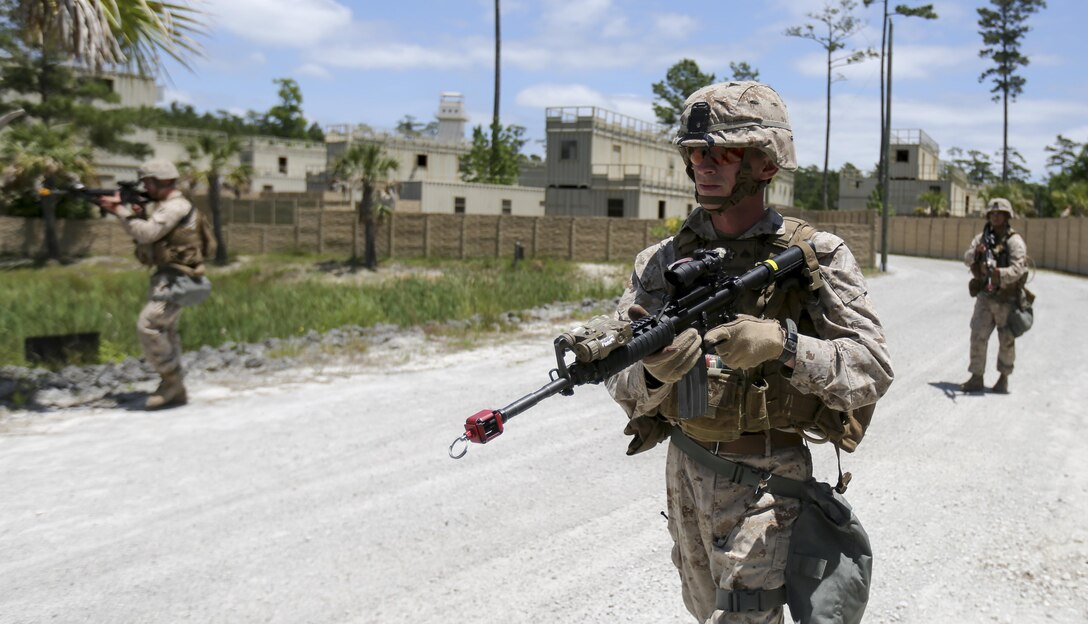 Marines with Company E, Battalion Landing Team 2/6 conduct military operations in urban terrain (MOUT) training at Mobile MOUT aboard Marine Corps Base Camp Lejeune, N.C., May 28, 2015. During the training, the Marines practiced patrolling, established vehicle checkpoints, and conducted  assault drills during day and night operations. (Photo by Staff Sgt. Bobby J. Yarbrough)