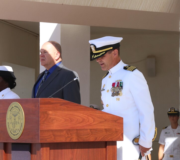 Navy Capt. Jay C. Sourbeer, former commanding officer, Robert E. Bush Naval Hospital Twentynine Palms, reads his orders during his change of command and retirement ceremony at the hospital May 29, 2015. In the Navy, it is customary for both the oncoming and off going commanders to read their orders during a change of command ceremony. (Official Marine Corps photo by Lance Cpl. Medina Ayala-Lo/Released)