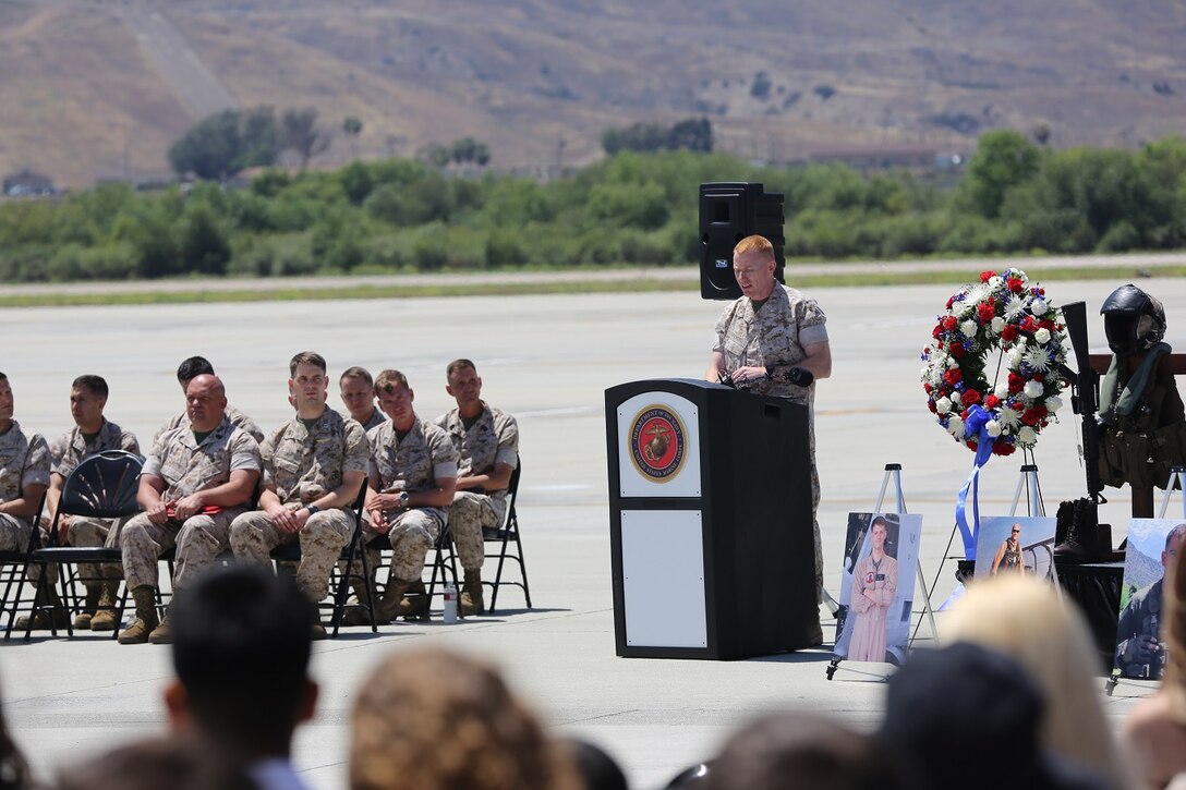 Lt. Col. Edward W. Powers, commanding officer of Marine Light Attack Helicopter Squadron (HMLA) 469, speaks during a memorial service aboard Marine Corps Air Station Camp Pendleton, California, June 3. The ceremony honored six Marines killed in a UH-1Y helicopter crash while conducting relief efforts in Nepal.