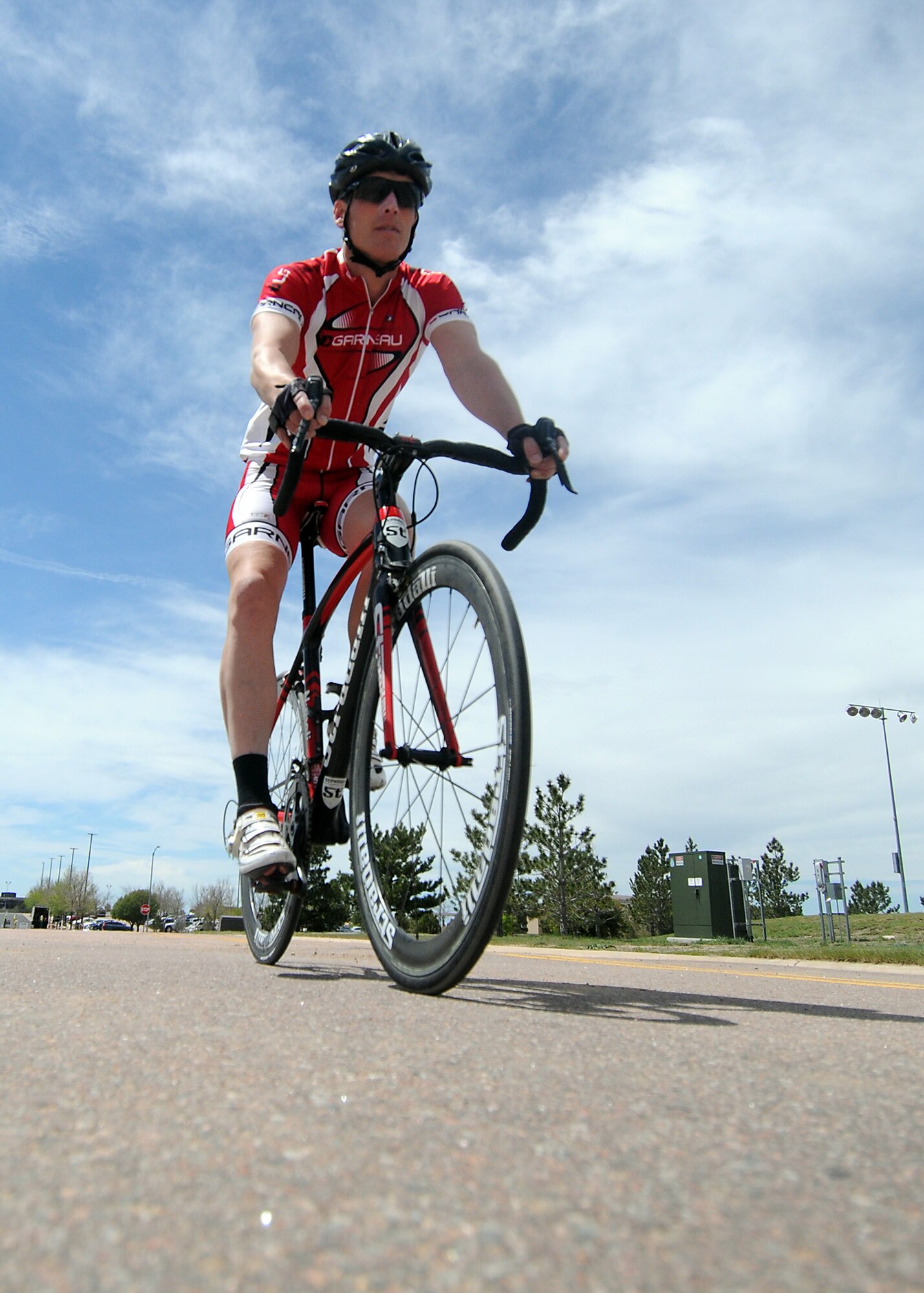 Derek Hamby, the 50th Space Wing Manpower and Organization chief, goes for a lunchtime bicycle ride at Schriever Air Force Base, Colo., May 28, 2015. Six months after sustaining life-threatening injuries from a serious bicycling accident, Hamby is preparing for a 100-mile mountain bike race. (U.S. Air Force photo/Staff Sgt. Debbie Lockhart)