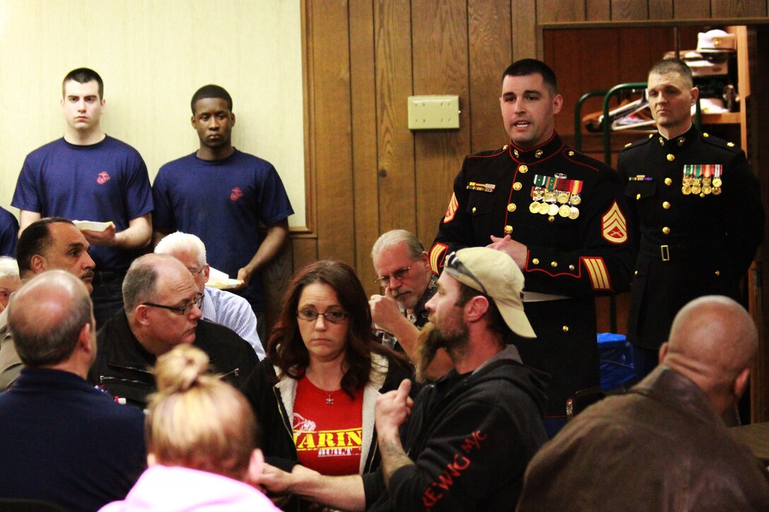 150408-M-BN069-062
U.S. Marine Corps Staff Sgt. Dominic Freda, the staff noncommissioned officer in charge of Recruiting Sub-Station Madison Heights answers questions and concerns from family members of poolees during a family night at the Veterans of Foreign Wars post  6691 in Fraser, Michigan, April 8, 2015. The family night was held as an opportunity for poolees to meet a drill instructor prior to attending recruit training. (U.S. Marine Corps photo by Cpl. J.R. Heins/Released)