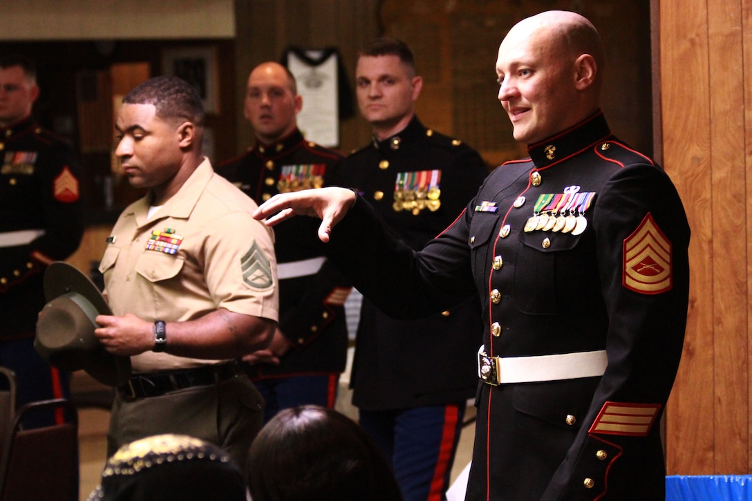 150408-M-BN069-073
U.S. Marine Corps Gunnery Sgt. Mitchell Nickolas, the staff noncommissioned officer in charge of Recruiting Sub-Station Sterling Heights addresses questions and concerns from family members of poolees during a family night at the Veterans of Foreign Wars post 6691 in Fraser, Michigan, April 8, 2015. The family night was held as an opportunity for poolees to meet a drill instructor prior to attending recruit training. (U.S. Marine Corps photo by Cpl. J.R. Heins/Released)