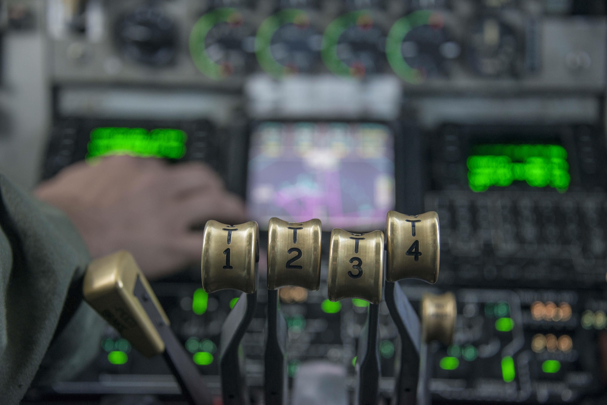 The throttles of a 92nd Air Refueling Wing KC-135 Stratotanker from Fairchild Air Force Base, Wash., enable pilots to control the aircraft’s four massive CFM International CFM-56 turbofan engines on the way to exercise Amalgam Dart 15-2 at Eielson AFB, Alaska, May 27, 2015. The KC-135’s engines each produce 21,634 pounds of thrust, propelling the aerial refueling and airlift aircraft at speeds up to 530 mph at 30,000 feet. (U.S. Air Force photo/Staff Sgt. Benjamin W. Stratton)